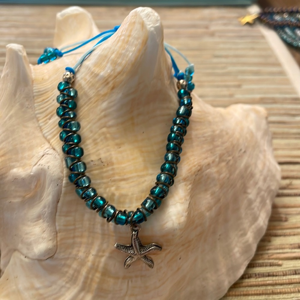 Mermaid core beaded macrame bracelet with silver colored  starfish dangle